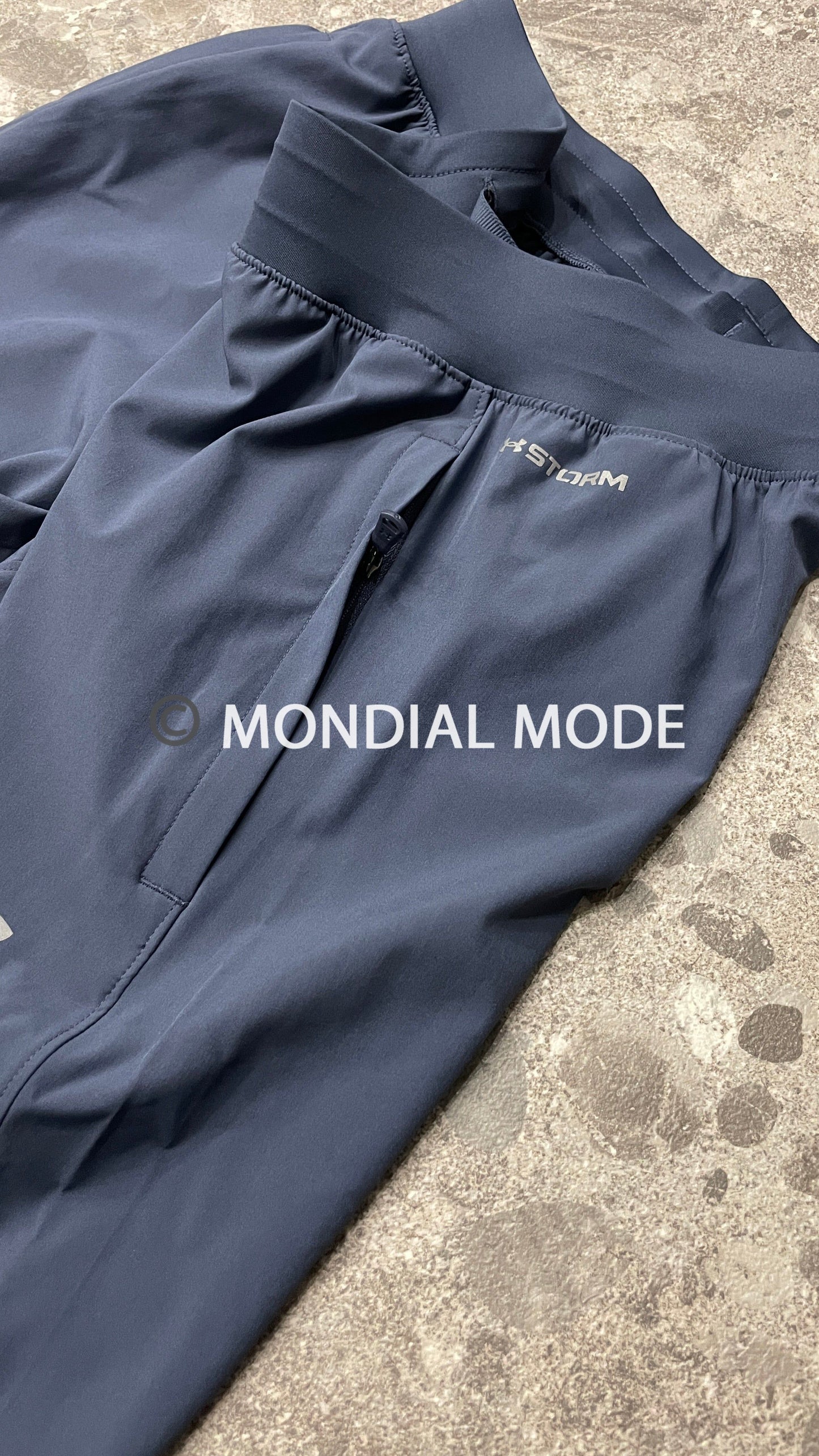 UA STORM TAPERED PANTS 1388549